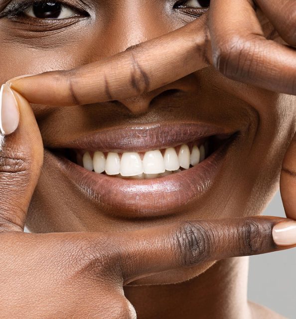 woman framing her beautiful smile
