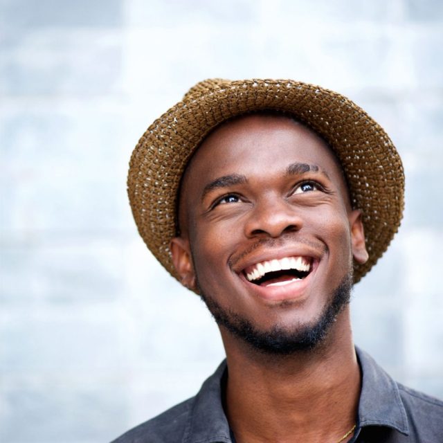 patient smiling after his digital design treatment from Dr. Clark