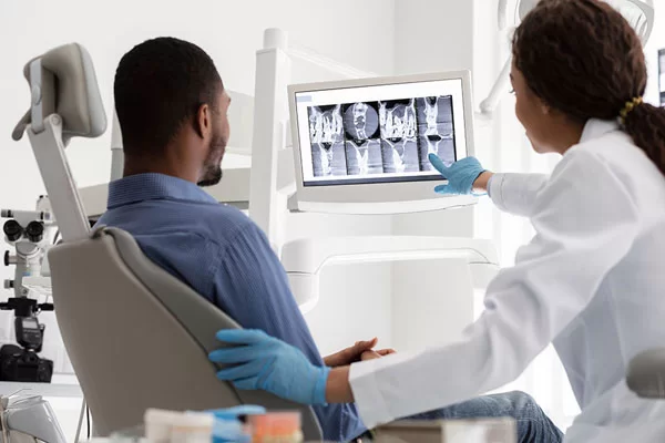 dentist checking x-ray